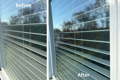 Close up macro shot of chalky white mineral spots on a glass pane